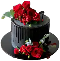 a black cake with red roses and berries on it