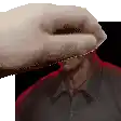 a pixelated image of a hand covering a man 's face .