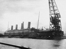 a black and white photo of a large ship called the rms olympic