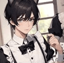 a girl with cat ears is wearing a maid outfit and a bow tie .