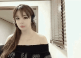 a woman wearing headphones with the letter i on the bottom