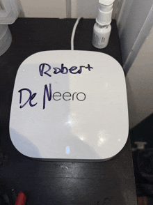 robert de neero is written on a small white device