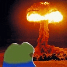 a green frog is looking at a large explosion in the distance .