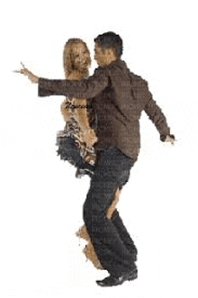 a man is holding a woman in his arms while they dance .