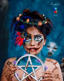 a woman is holding a pentagram in front of a sign that says george rath studios