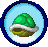 a green turtle is in a blue circle in a pixel art .