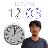 a man stands in front of a clock that reads 12:03