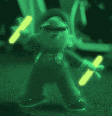 a glow in the dark mario figure is holding glow sticks