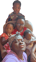 a woman in a purple shirt is holding a baby and two children