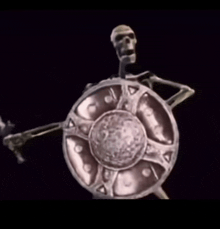 a statue of a skeleton holding a shield and sword