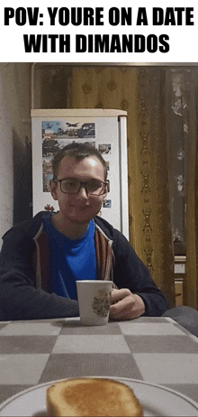 a man with glasses sits at a table with a cup of coffee and toast