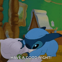 a cartoon of stitch laying on a bed with the caption have a good night