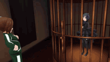 a girl in a green tracksuit stands next to a girl in a black dress behind bars