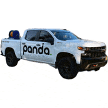 a white truck with the word panda on the side of it