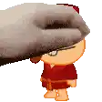 a person is petting a cartoon character 's face with their hand .