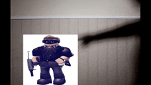 a shadow of a person is cast on a wall next to a picture of a roblox character