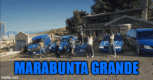 a group of people standing in front of blue cars with the words marabunta grande