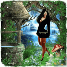 a woman in a black dress is standing in front of a waterfall in a forest