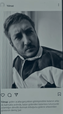a black and white photo of a man with a caption that says ylmaz