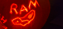 a carved pumpkin has the word ram written on it