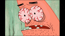 patrick star from spongebob squarepants is making a funny face with red eyes