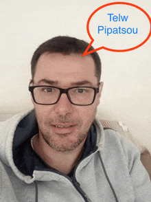 a man with glasses and a speech bubble that says telw pipasou