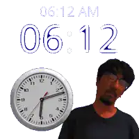 a man stands in front of a wall clock that says 0612 am