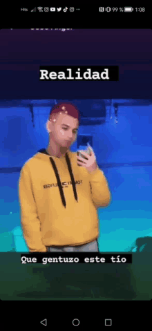 a man in a yellow hoodie is holding a cell phone with the word realidad above him