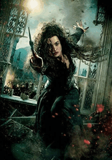 a woman is holding a wand in her hand in a movie poster for harry potter and the deathly hallows part ii .