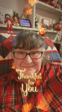 a woman wearing glasses and a plaid shirt with the words thankful for you on her face