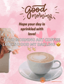 a cup of coffee sits on a saucer next to a vase of flowers and a good morning message