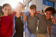 a group of young men are posing for a picture and smiling