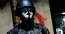 a soldier wearing a helmet and a mask with a skull on it