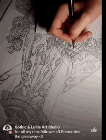 a gothic & lolita art studio drawing with a thumb up