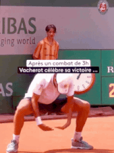 a man is squatting on a tennis court in front of a bnp paribas ad