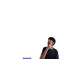 a man is standing in front of a playing card with spades on it