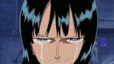 a close up of a person 's face with tears running down their face