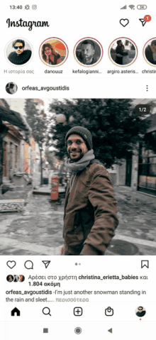 a screenshot of the instagram app showing a picture of a man standing in the rain