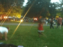 a blurry picture of people playing in a park