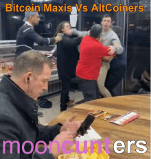 a man sitting at a table looking at his phone with the words bitcoin maxis vs altcoins mooncunters written on the bottom