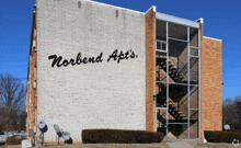 a brick building with the words norbend ap 's written on it