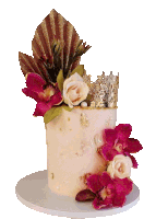 a cake with flowers and a crown that says axc on top