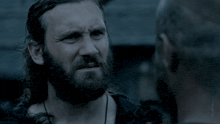 a man with a beard says it 's the truth in front of another man
