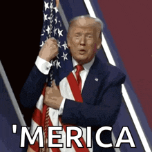 a man in a suit and tie is holding an american flag and says merica