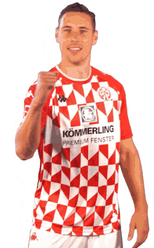 a man wearing a red and white shirt that says kommerling premium fenster on it