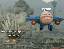 a toy airplane is flying over a city with the words les chiottes apres un tacos