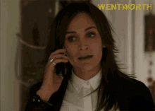 a woman talking on a cell phone with wentworth written in yellow