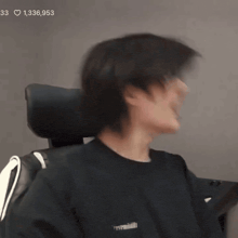 a blurry picture of a person laughing with the number 33 on the bottom right