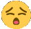 a yellow smiley face with its eyes closed and a pink tongue .