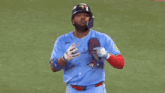 a baseball player wearing a blue jays jersey says " just breathe "
